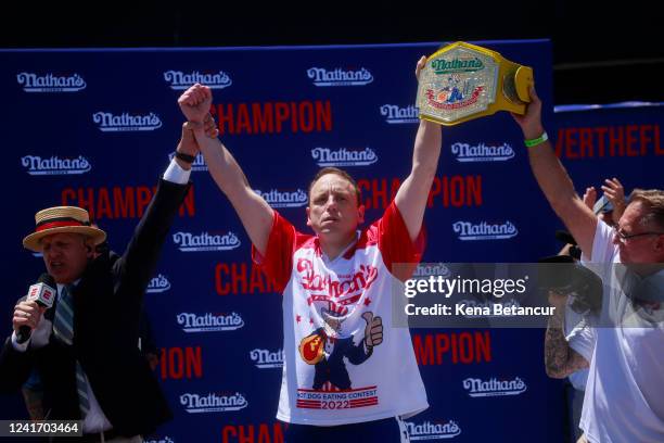 Joey Chestnut reacts after winning first place, eating 63 hot dogs in 10 minutes, during the 2022 Nathans Famous Fourth of July International Hot Dog...