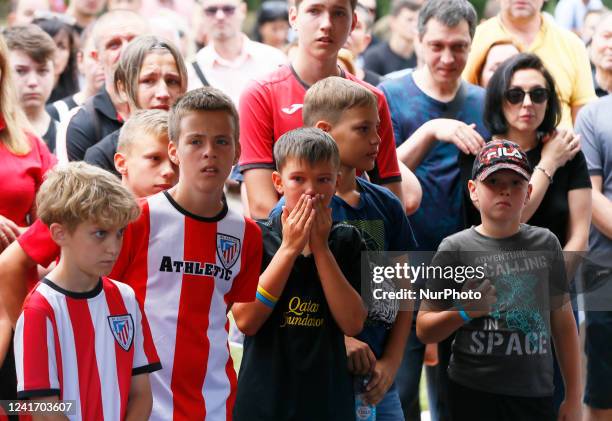 Children of the soccer club ''Athletic&quot; attend a farewell ceremony for the late Ukrainian soccer coach Oleksandr Shyshkov who died during a...