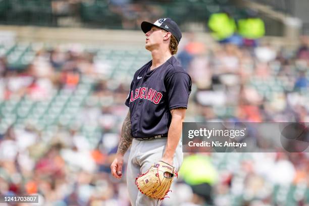 Zach Plesac of the Cleveland Guardians reacts after delivering a pitch against the Detroit Tigers during the bottom of the fourth inning at Comerica...