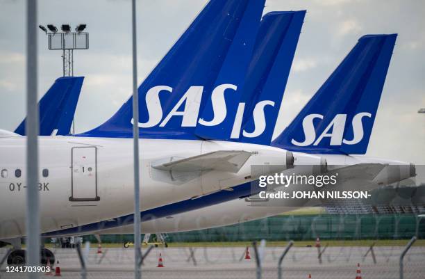 Scandinavian airline SAS aircraft of the type Airbus A321 and A320 Neo are parked at Kastrup airport on July 4, 202 after the 900 pilots at SAS went...