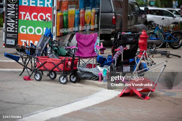 Seats used by parade watchers are left abandoned at the scene after a mass shooting at a Fourth of July parade on July 4, 2022 in Highland Park,...