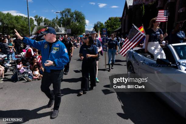 Sen. Mark Kelly, D-Ariz., left, and Gabby Giffords participate in the Flagstaff Chamber of Commerce Fourth of July Parade in Flag staff, Ariz., on...