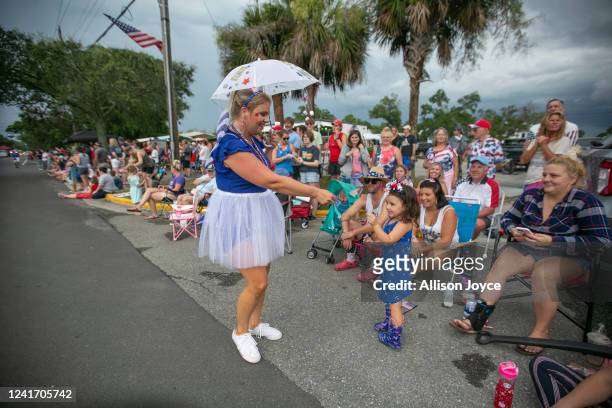 Residents participate in the annual Independence Day Parade on July 4, 2022 in Southport, North Carolina. The U.S. Declaration of Independence was...