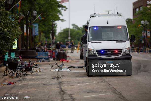 First responders work the scene of a mass shooting at a Fourth of July parade on July 4, 2022 in Highland Park, Illinois. At least six people were...