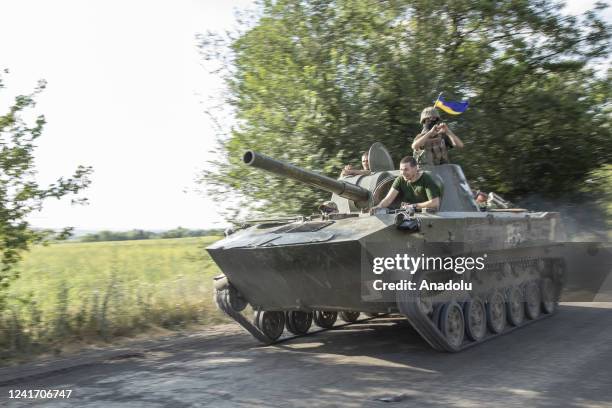 Ukrainian serviceman ride on top of a tank towards the battlefield in Siverisk frontline, Ukraine, July 04th, 2022.