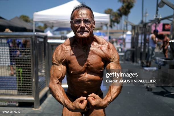 Bodybuilder Mark Pacheco poses during the Mr. & Ms. Muscle Beach championship on Independence Day in Venice, California on July 4, 2022. - Venice is...