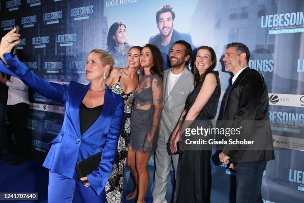 Anika Decker takes a selfie with Peri Baumeister, Lucie Heinze, Elyas M'Barek, Alexandra Maria Lara and Rick Kavanian during the premiere of the new...