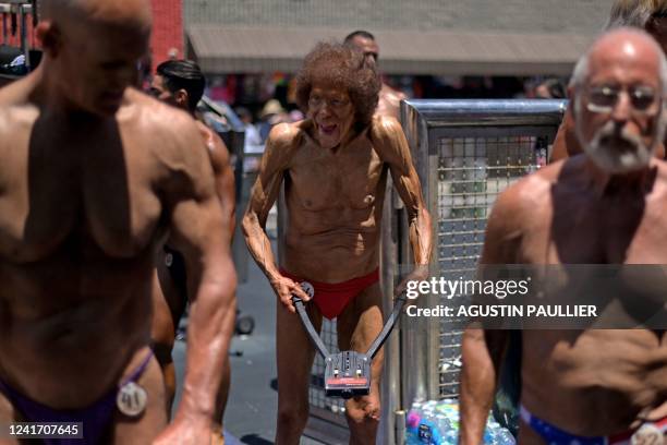 Contestants warm up during the Mr. & Ms. Muscle Beach championship on Independence Day in Venice, California on July 4, 2022. - Venice is one of two...