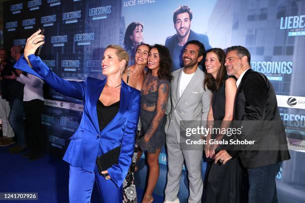 Anika Decker takes a selfie with Peri Baumeister, Lucie Heinze, Elyas M'Barek, Alexandra Maria Lara and Rick Kavanian during the premiere of the new...