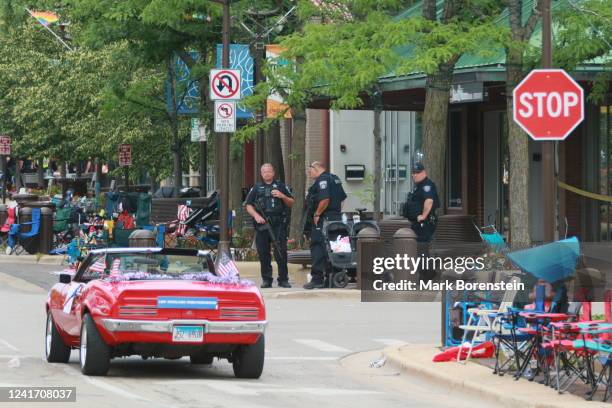 Belongings are shown left behind at the scene of a mass shooting along the route of a Fourth of July parade on July 4, 2022 in Highland Park,...