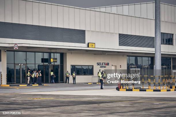 Passengers enter the airport building after disembarking from a Firefly Airline flight from Subang, Malaysia at Seletar Airport in Singapore, on...