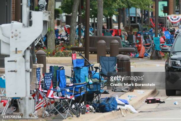 Belongings are shown left behind at the scene of a mass shooting along the route of a Fourth of July parade on July 4, 2022 in Highland Park,...