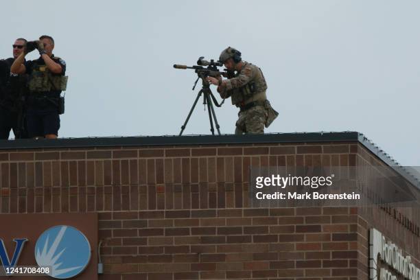 Law enforcement work the scene of a shooting at a Fourth of July parade on July 4, 2022 in Highland Park, Illinois. Police have detained Robert...