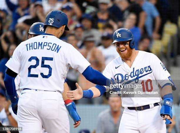 Trayce Thompson of the Los Angeles Dodgers celebrates his three run home run against starting pitcher Kyle Freeland of the Colorado Rockies with...