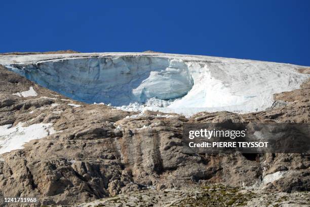 Picture taken near Canazei on July 5, 2022 shows the hole in the glacier of the Marmolada mountain two days after its collapse. The deadly collapse...