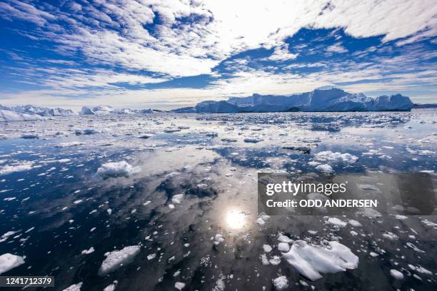 Icebergs float in Disko Bay, Ilulissat, western Greenland, on June 28, 2022. The icebergs originate from Jakobshavn glacier , the most productive...