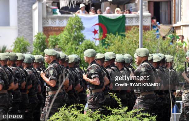Algerian soldiers parade down a street in the capital Algiers on July 5 as the country celebrates the 60th anniversary of its independence.