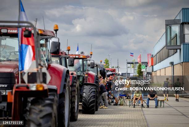 Farmers block the entrance of the distribution center of a supermarket to protest against the government's nitrogen policy in Nijkerk on July 5 2022....