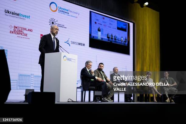 Ukrainian Prime Minister Denys Shmyhal delivers a speech next to Chair of the Board, Swiss Investment Fund Joerg Frieden , Ukraine's MP Davyd...