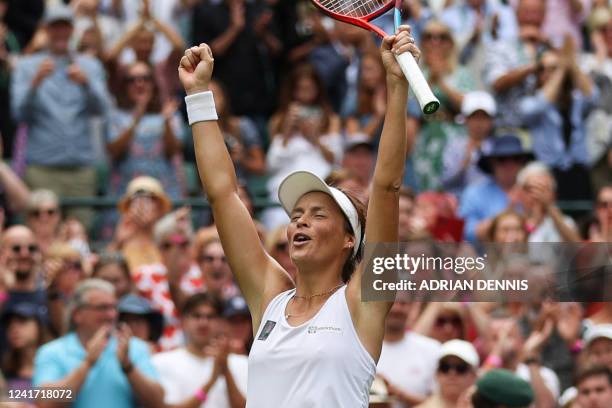 Germany's Tatjana Maria celebrates after winning against Germany's Jule Niemeier during their women's singles quarter final tennis match on the ninth...