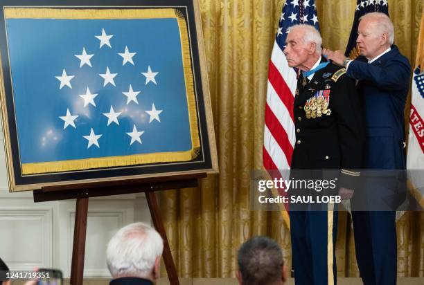 President Joe Biden awards the Medal of Honor to retired US Army Major, John J. Duffy, for his actions in the Vietnam War, during a ceremony in the...