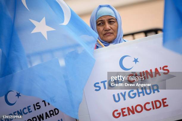 Supporters of the East Turkistan National Awakening Movement rally in front of the White House to commemorate the 13th anniversary of the July 5th...