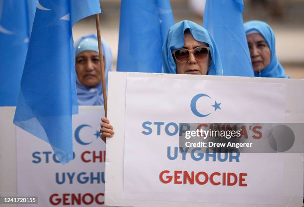 Supporters of the East Turkistan National Awakening Movement rally in front of the White House to commemorate the 13th anniversary of the July 5th...