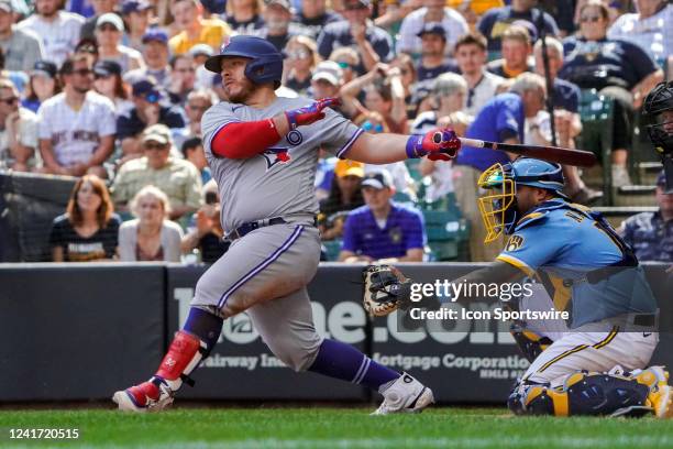 Toronto Blue Jays catcher Alejandro Kirk hits a three-run home run during a game between the Milwaukee Brewers and Toronto Blue Jays on June 26, 2022...