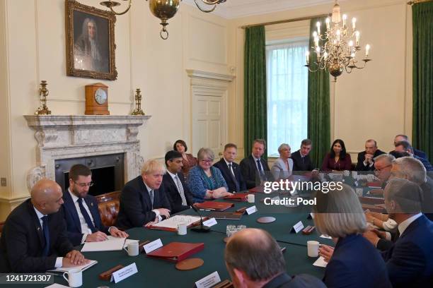 Britain's Health Secretary Sajid Javid and Britain's Chancellor of the Exchequer Rishi Sunak listen with colleagues as Britain's Prime Minister Boris...