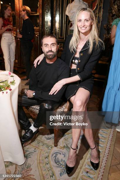 Giambattista Valli and Lauren Santo Domingo at Galerie Gismondi on July 5, 2022 in Paris, France.