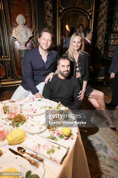 Derek Blasberg, Giambattista Valli and Lauren Santo Domingo at Galerie Gismondi on July 5, 2022 in Paris, France.