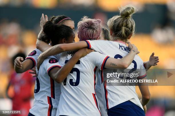 Megan Rapinoe hugs to her teammates during their 2022 Concacaf Women's Championship football match against Haiti, at the Universitario stadium in...