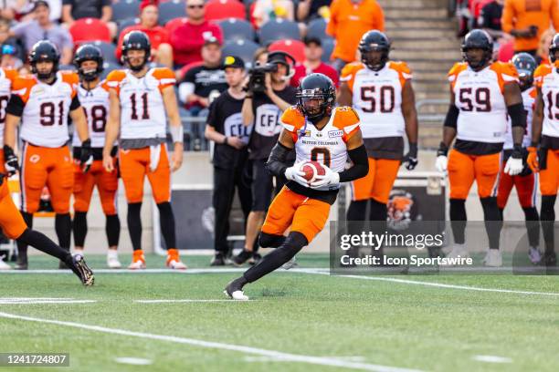 Lions defensive back Loucheiz Purifoy runs with the ball during Canadian Football League action between the BC Lions and Ottawa Redblacks on June 30...
