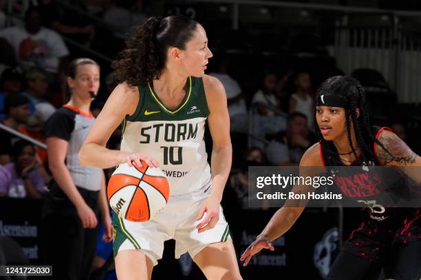 Destanni Henderson of the Indiana Fever plays defense on Sue Bird of the Seattle Storm during the game on July 5, 2022 at Gainbridge Fieldhouse in...