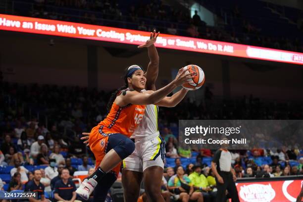 Brionna Jones of the Connecticut Sun drives to the basket during the game against the Dallas Wings on July 5, 2022 at the College Park Center in...