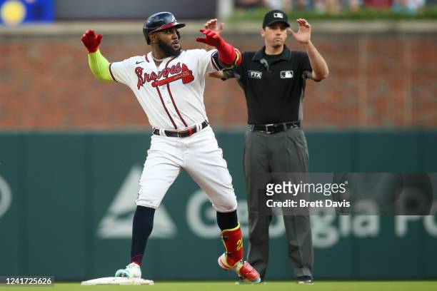 Marcell Ozuna of the Atlanta Braves celebrates after a double against the St. Louis Cardinals in the first inning at Truist Park on July 5, 2022 in...