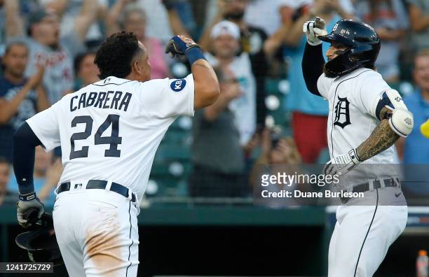 Eric Haase of the Detroit Tigers celebrates with Miguel Cabrera after hitting two-run home run against the Cleveland Guardians during the fourth...
