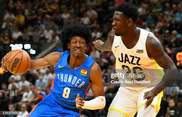 Jalen Williams of the Oklahoma City Thunder drives into Kofi Cockburn of the Utah Jazz during a NBA Summer League game at Vivint Arena on July 05,...