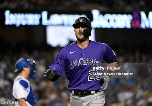 Kris Bryant of the Colorado Rockies celebrates his solo home run against relief pitcher Phil Bickford of the Los Angeles Dodgers during the seventh...
