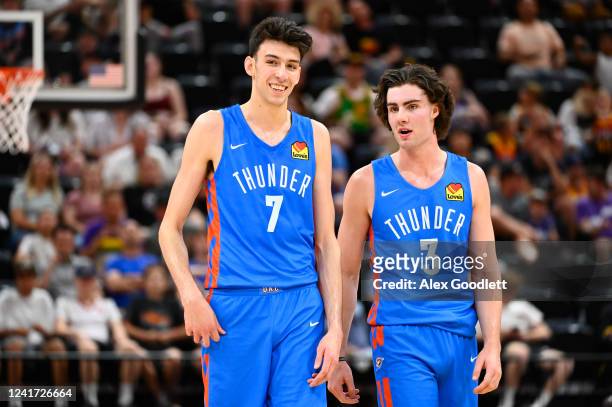 Chet Holmgren of the Oklahoma City Thunder speaks with teammate Josh Giddey during a NBA Summer League game against the Utah Jazz at Vivint Arena on...
