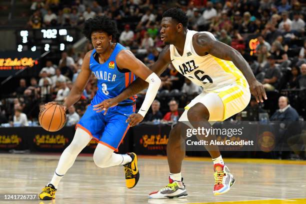 Jalen Williams of the Oklahoma City Thunder drives into Kofi Cockburn of the Utah Jazz during a NBA Summer League game at Vivint Arena on July 05,...
