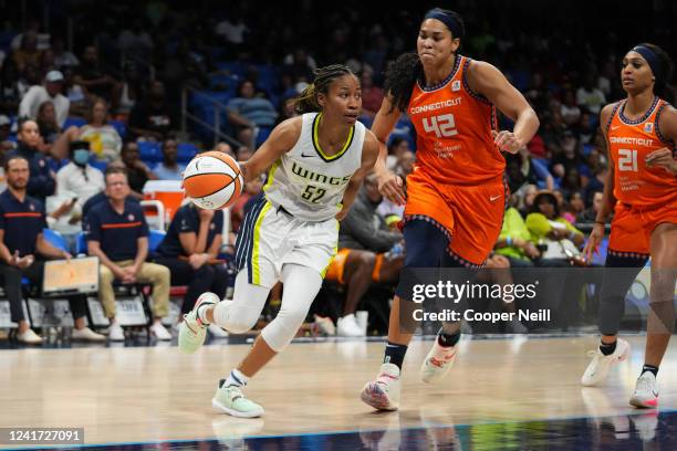 Tyasha Harris of the Dallas Wings drives to the basket during the game against the Connecticut Sun on July 5, 2022 at the College Park Center in...