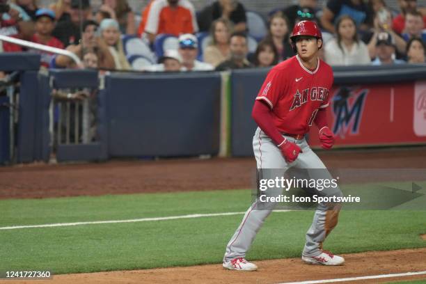 Los Angeles Angels center fielder Mike Trout eyes home plate from third base during the game between the Los Angeles Angels of Anaheim and the Miami...