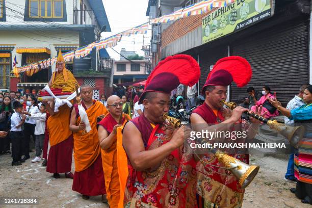 Exiled Tibetans participate in a procession to mark the 87th birthday of their spiritual leader, the Dalai Lama, at Jawalakhel Tibetan refugee camp...