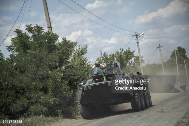 Ukrainian servicemen are seen riding on top of a tank towards the battlefield in Siverisk frontline, Ukraine on July 05, 2022.