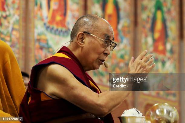 Tibetan spiritual leader Dalai Lama gestures as he speaks during the inaguaration of a museum on his 87th birthday, in Dharamsala on July 6, 2022.