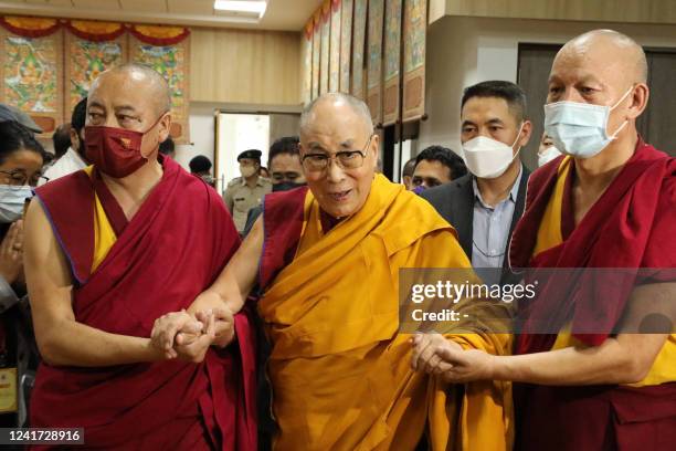 Tibetan spiritual leader Dalai Lama is assisted as he arrives for the inaguaration of a museum on his 87th birthday, in Dharamsala on July 6, 2022.