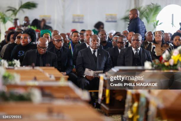 South African President Cyril Ramaphosa looks on during a symbolic mass memorial service in East London on July 6 after 21 people, mostly teens, died...