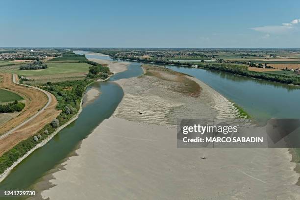 An aerial view taken on July 5 show low levels of the Po River in the area of the municipality of Castelmassa, in the region of Veneto, were water is...