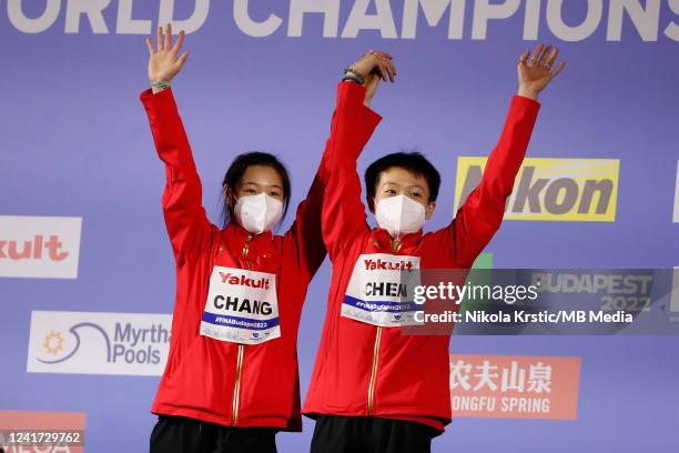 Yiwen Chen and Yani Chang of China celebrate during the medal ceremony in the Women's Synchronized 3m Springboard Final on day eight of the Budapest...